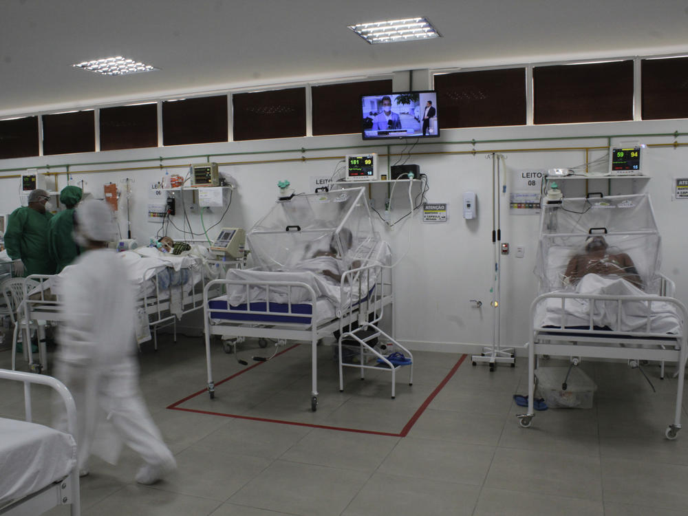 Health staff treat patients with COVID-19 at the Gilberto Novaes Field Hospital on May 28 in Manaus, Brazil.