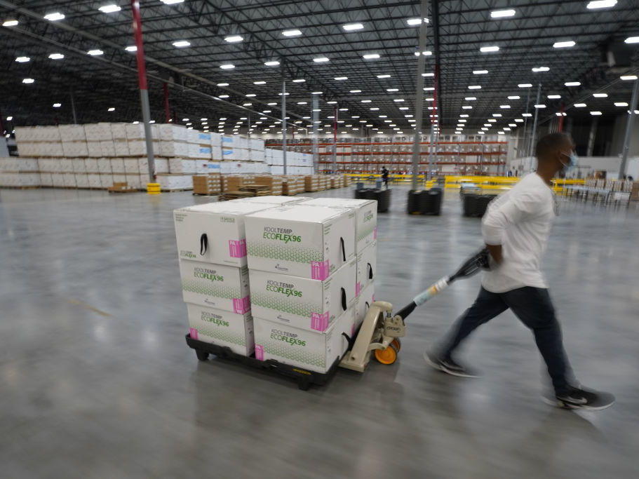 Boxes containing the Moderna COVID-19 vaccine are prepared to be shipped at the McKesson distribution center in Olive Branch, Miss. The vaccine campaign needs further federal support, experts say, to speed the effort.
