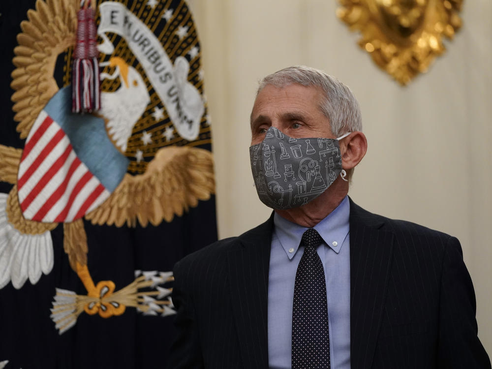 Dr. Anthony Fauci, director of the National Institute of Allergy and Infectious Diseases, arrives for an event on the coronavirus with President Biden at the White House on Thursday.