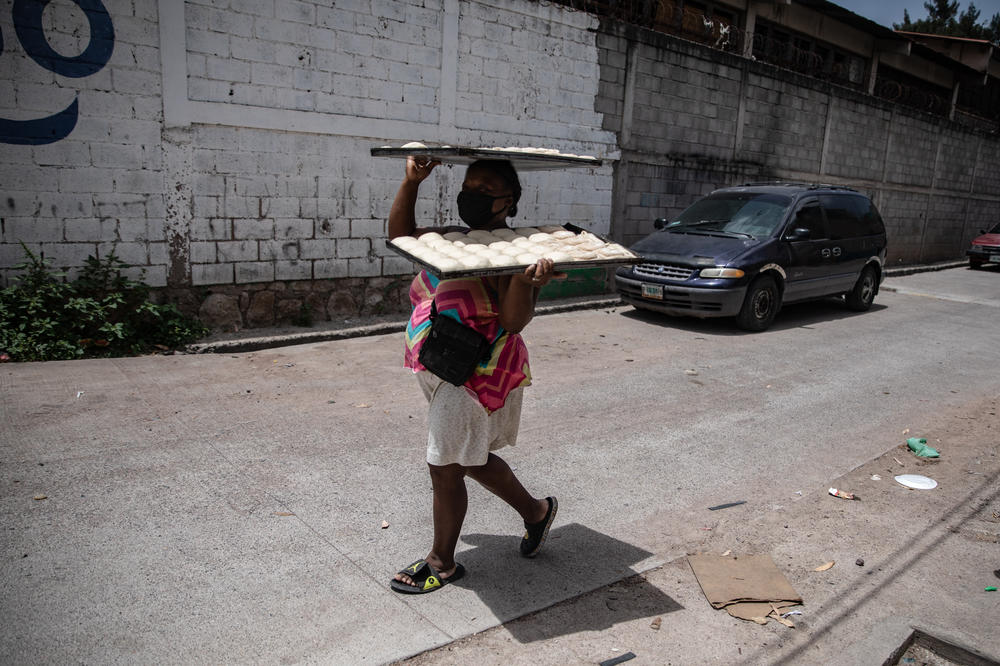 Along with other members of the Garifuna diaspora in the downtown capital district, Ella baked sheets of coconut bread every day at a community oven a block over from her home as the household's primary source of income.