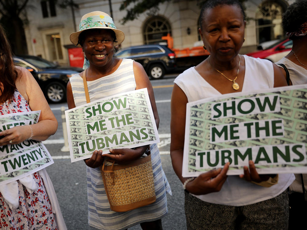 Supporters rally outside the U.S. Treasury Department in 2019 to demand that American abolitionist Harriet Tubman's image be put on the $20 bill.