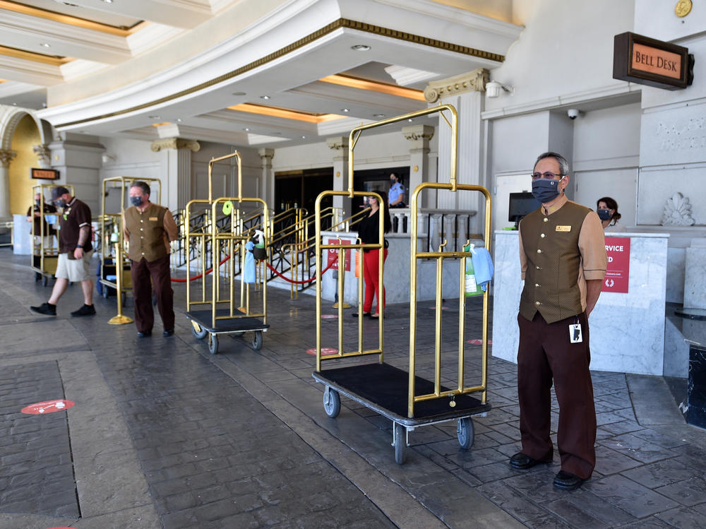 Hotel staff stand ready to receive guests on June 4, 2020, at Caesars Palace in Las Vegas. U.S. hotels hit all-time lows in occupancy and in revenue per available room last year.