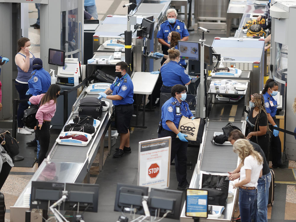 TSA agents clearing passengers at Denver International Airport, June 2020. TSA found twice as many weapons on passengers per million in 2020 than they did the year prior.