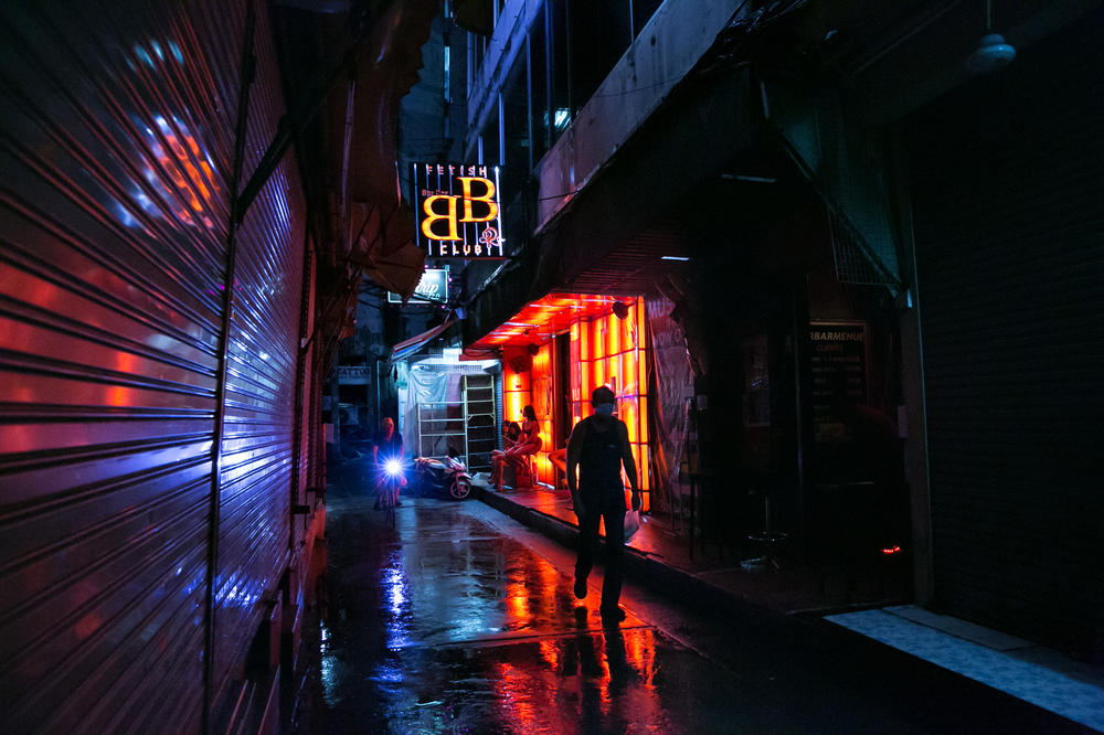 The relatively empty Patpong red-light district in Bangkok. In March and April, Thailand closed its borders and canceled commercial flights because of the global pandemic. The country's tourism industry — which is entwined with the sex worker industry — collapsed.