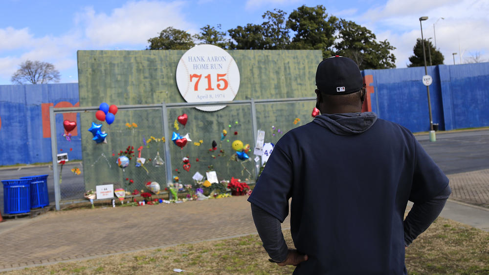 Fans pay their respects to Hank Aaron at the 715 Wall — site of Aaron's historic home run on the former grounds of Fulton County Stadium, the previous home of the Atlanta Braves.