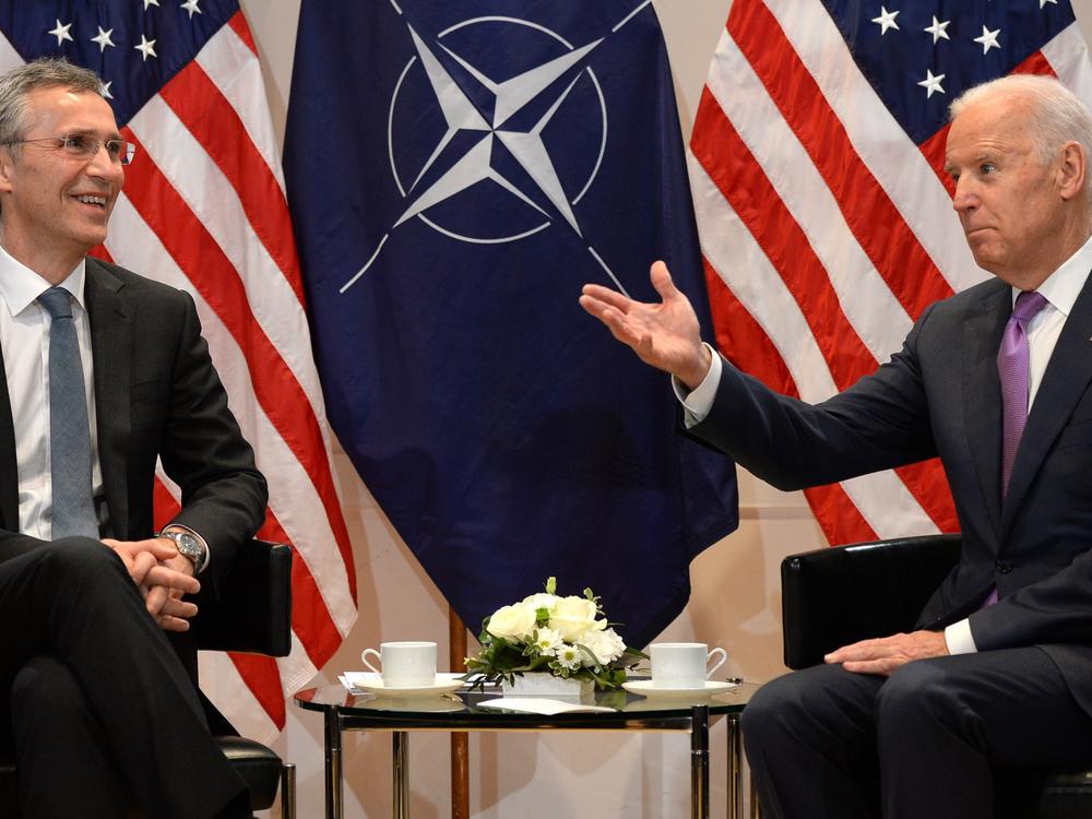 NATO Secretary General Jens Stoltenberg and then-Vice President Joe Biden talk during the 51st Munich Security Conference in February 2015.