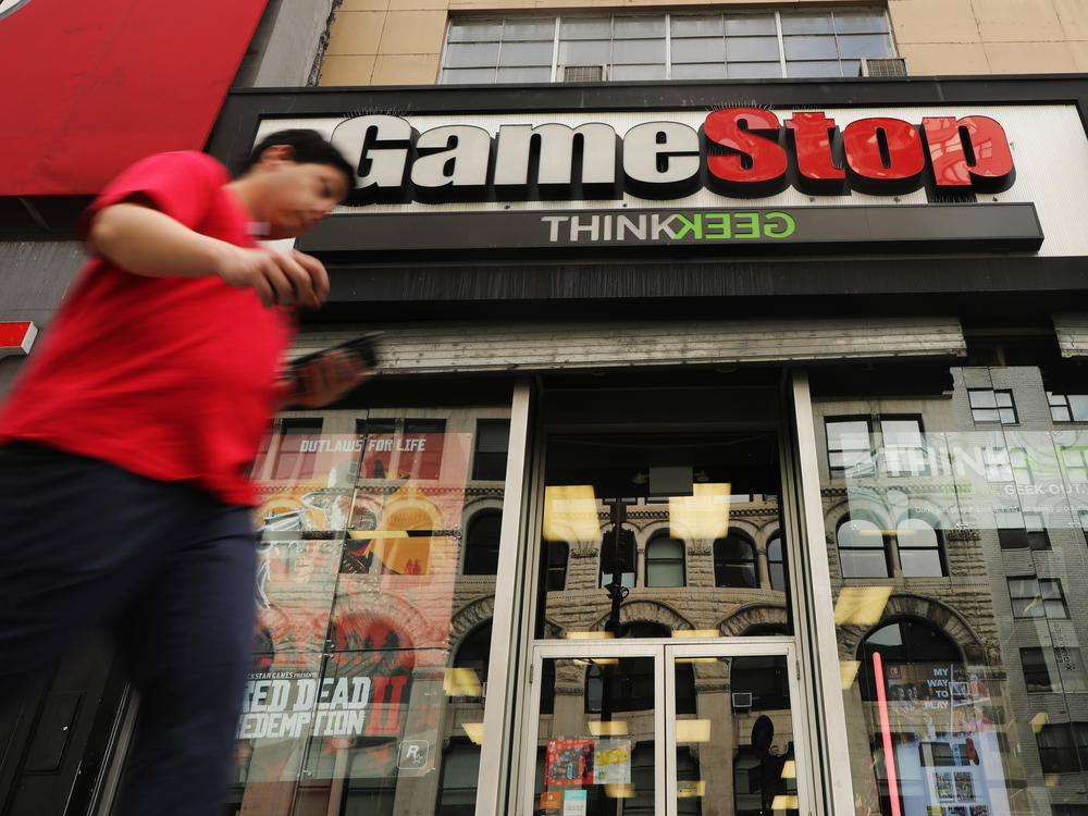 Video game retailer GameStop has seen its stock soar, driven higher by a group of amateur day traders on Reddit, who are taking on Wall Street hedge funds. The frenzy has gotten the attention of regulators and lawmakers.