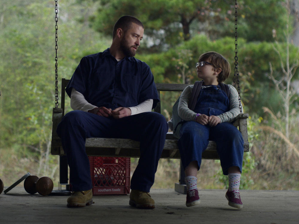 Justin Timberlake (left) and Ryder Allen star as Eddie and Sam in the new movie <em>Palmer </em>on Apple TV+.