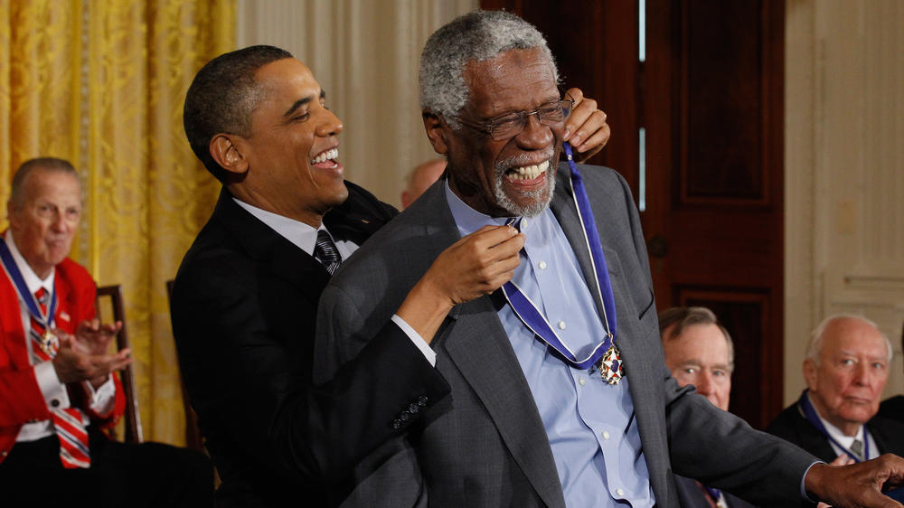 Then-President Barack Obama awards Russell with the Presidential Medal of Freedom at the White House in February 2011.
