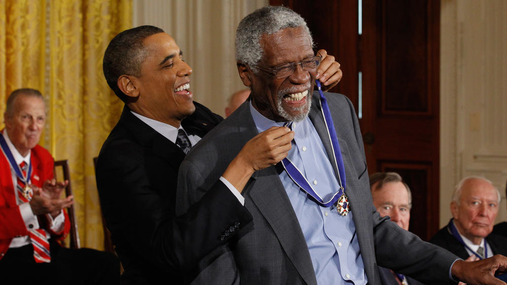 Then-President Barack Obama awards Russell with the Presidential Medal of Freedom at the White House in February 2011.