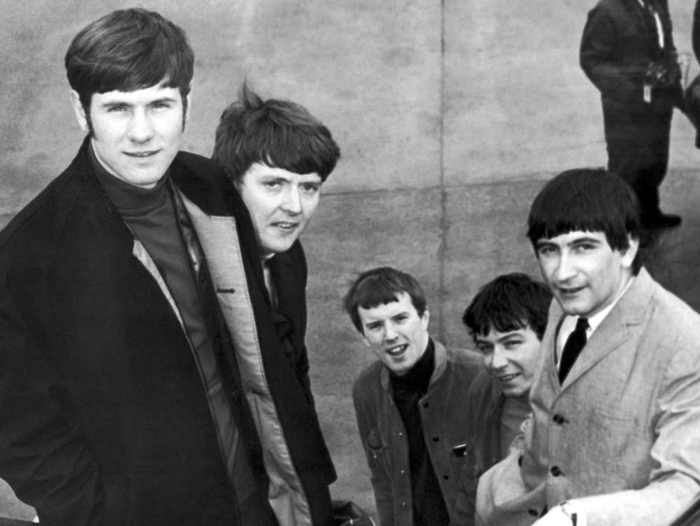 The Animals, from left, Hilton Valentine, Chas Chandler, John Steel, Eric Burdon and Dave Rowberry, board an airliner in London bound for New York on May 27, 1965, to appear on 