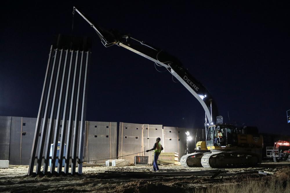 U.S. Workers build the new 13-mile border wall construction project in the desert between Sunlad Park, N.M., and Ciudad Juarez, Chihuahua, Mexico on Jan. 15.