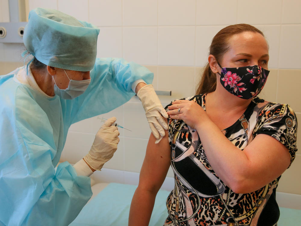 Russia's Sputnik vaccine was found to be effective in preventing COVID-19 symptoms, according to a new study published in <em>The Lancet</em> medical journal. Here, a patient gets a shot of the Russian vaccine at Sochi's City Hospital No 4.