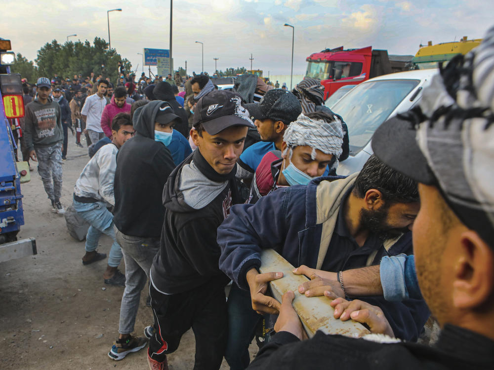 Protesters block a road leading to an oil complex during anti-government protests in Basra in December.