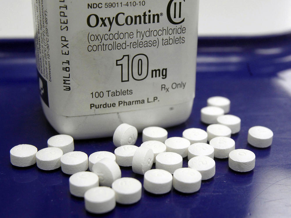 OxyContin pills arranged for a photo at a pharmacy in Montpelier, Vt. The global business consulting firm McKinsey & Company has agreed to a $573 million settlement over its role in the opioid crisis.