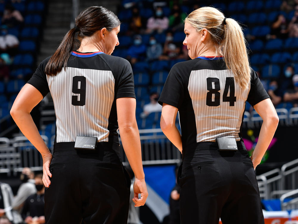 Referees Natalie Sago #9 and Jenna Schroeder #84 during the game between the Charlotte Hornets and Orlando Magic on January 25, 2021 in Orlando. It was the first time two women officiated an NBA game.