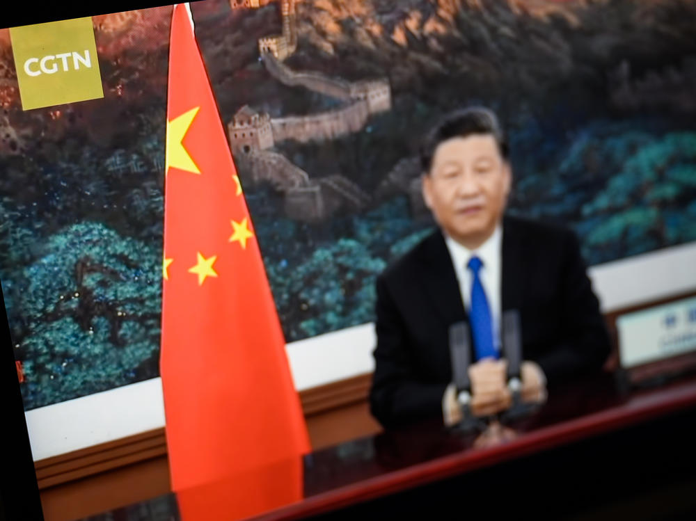 President Xi Jinping of China is seen on a CGTN archive program as it plays on a computer monitor in London. The U.K.'s Ofcom says Star China Media Limited, which holds the license for China Global Television Network (CGTN) doesn't have day-to-day editorial control over the channel, which is against its rules.