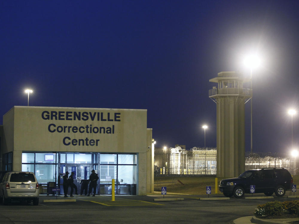 Prison guards stand outside the entrance to the Greensville Correctional Center where executions are carried out, in Jarratt, Va., on Sept. 23, 2010. This week, lawmakers in Virginia voted to abolished the death penalty.