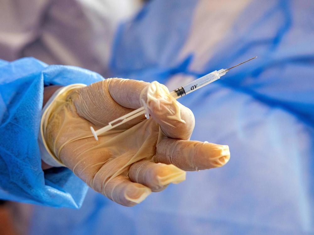 A Moroccan nurse holds a syringe containing a dose of the COVID-19 vaccine on Jan. 29. Morocco is one of the many countries that will receive COVID-19 doses as part of the COVAX initiative.