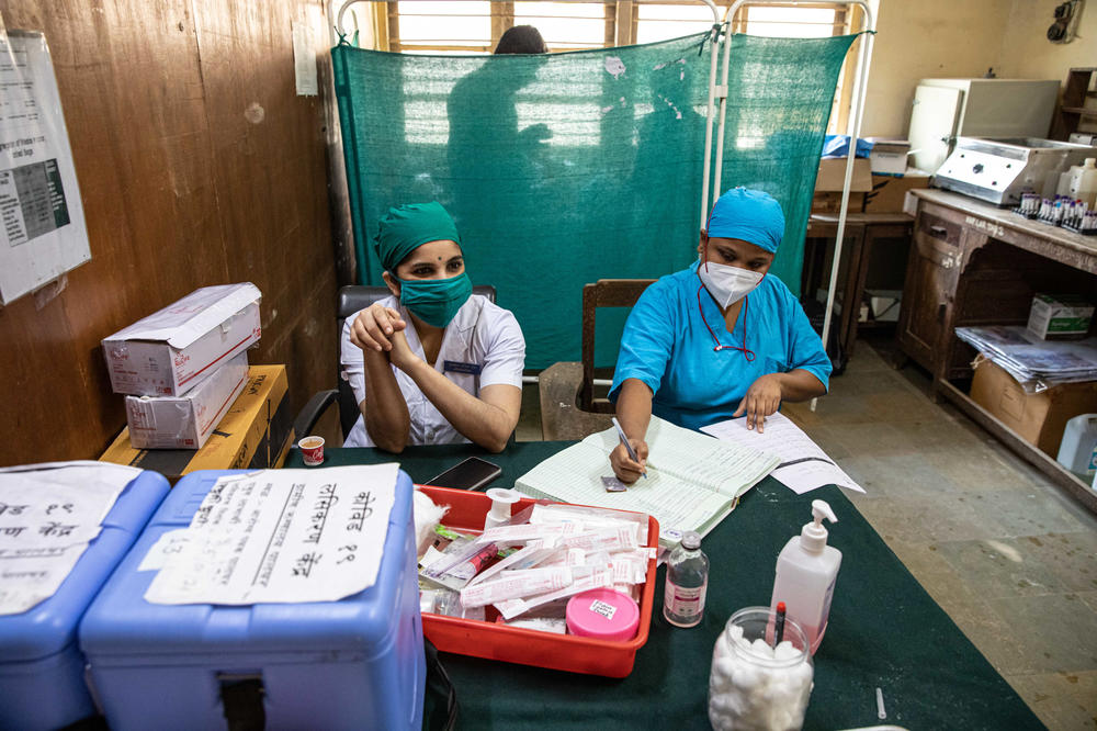Nurses Sarika Patil (left) and Priyanka Gavai (right) in the room in the Palghar Rural Hospital where vaccines are readied.