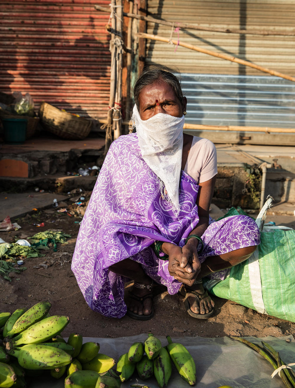 Asked if she'll take the vaccine, vegetable vendor Kunta Dubra replies, 