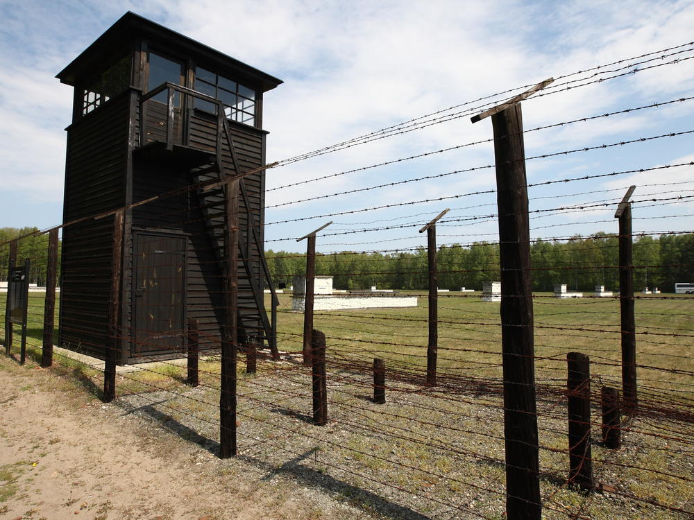 A former typist and secretary at the Stutthof concentration camp in Poland is charged with being complicit in mass murder. The camp, seen here in 2016, has become a museum.