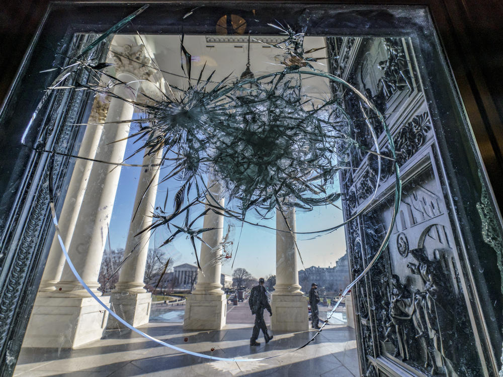 Shattered glass from the attack on the Capitol by a pro-Trump mob is seen in the doors leading to the Capitol Rotunda on Jan. 12.