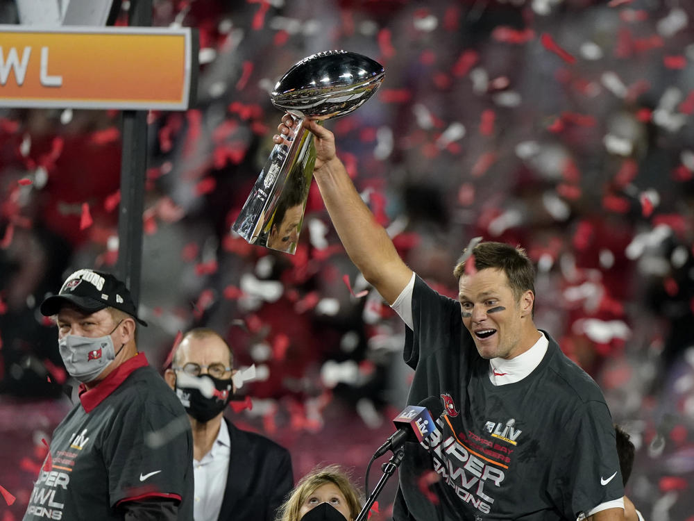 Quarterback Tom Brady celebrates with the Vince Lombardi Trophy after leading the Tampa Bay Buccaneers to Super Bowl victory against the Kansas City Chiefs on Sunday.