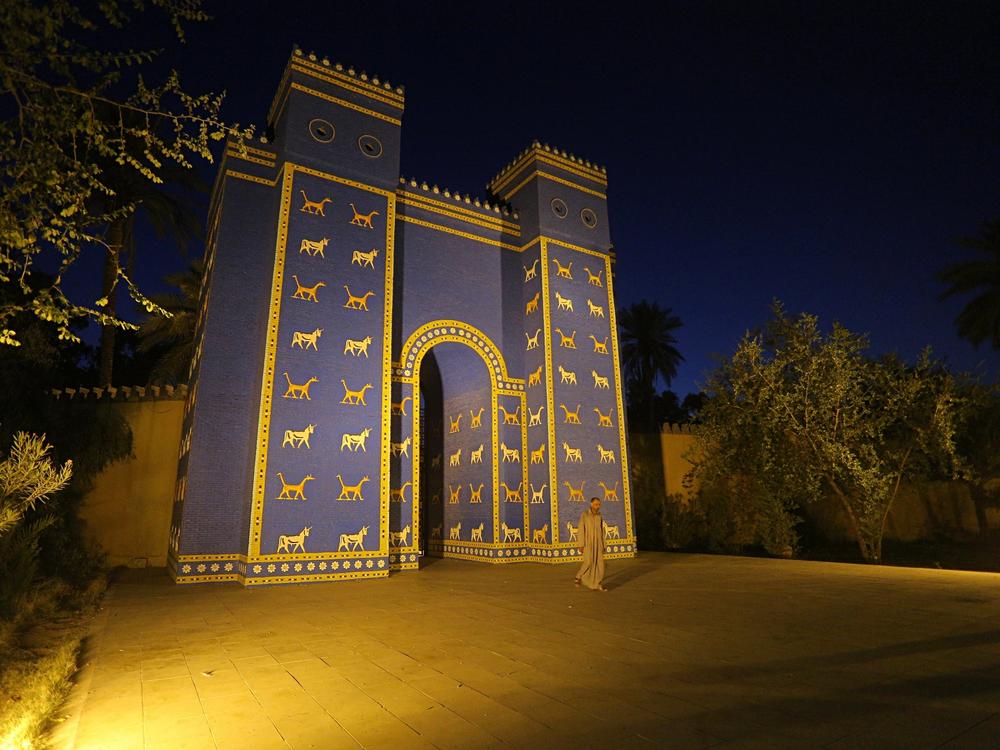 A man walks in front of Ishtar Gate at the site of Babylon, Iraq, in 2019.