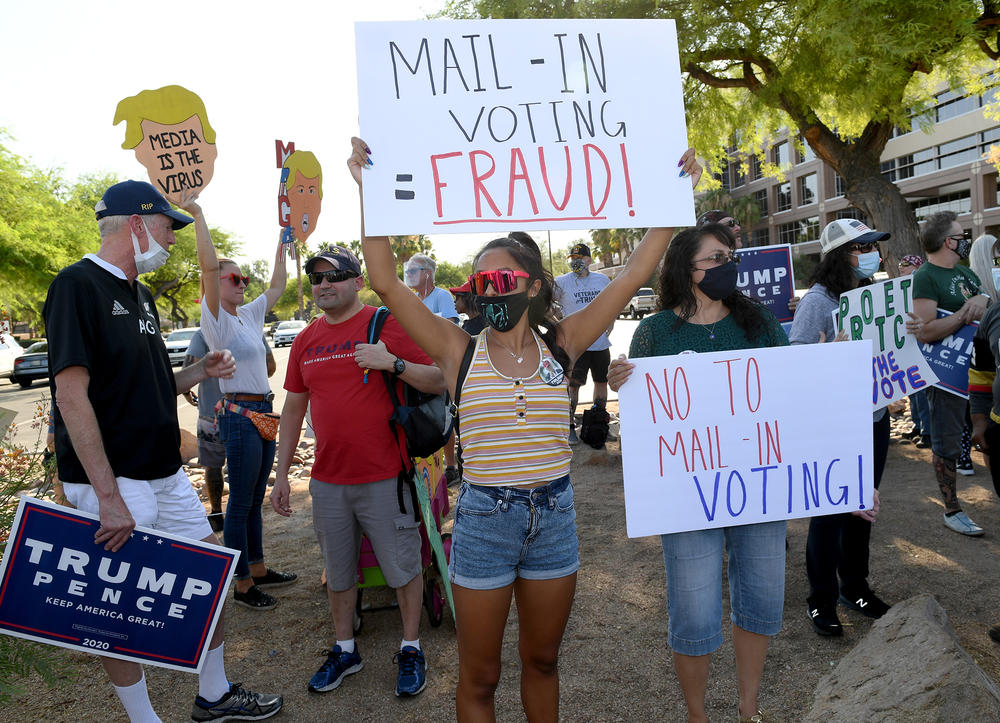 Trump supporters protest against the passage of a mail-in voting bill during a Nevada Republican Party demonstration.