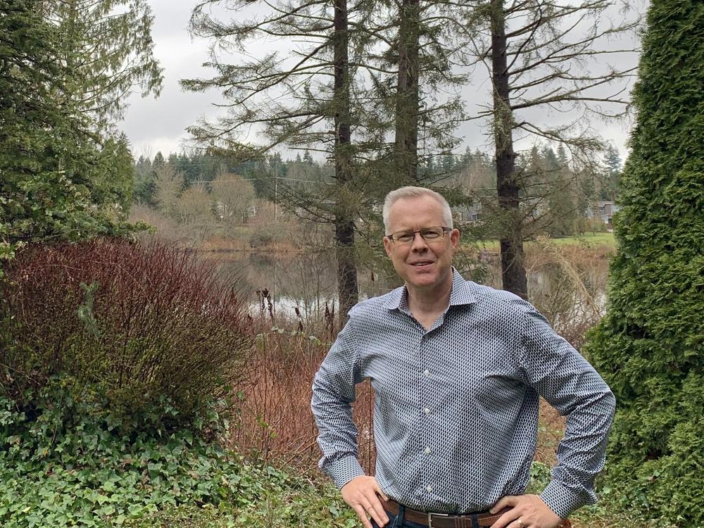 Epik CEO Rob Monster standing in the backyard of his home in Sammamish, Wash.