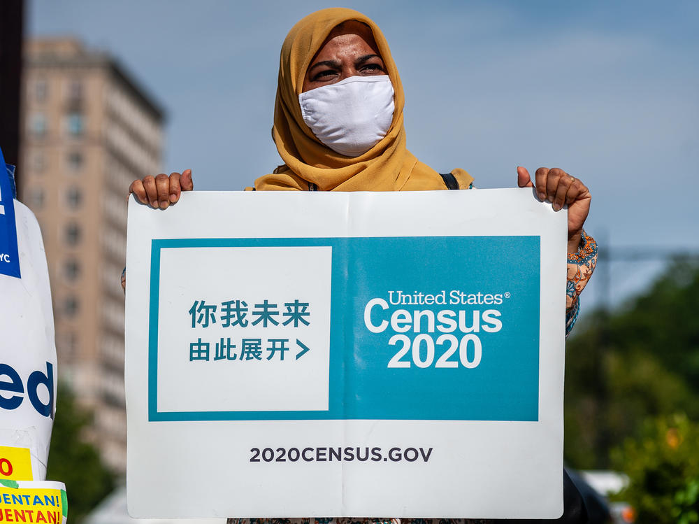 A census supporter holds up a sign during a 2020 rally in  New York City.