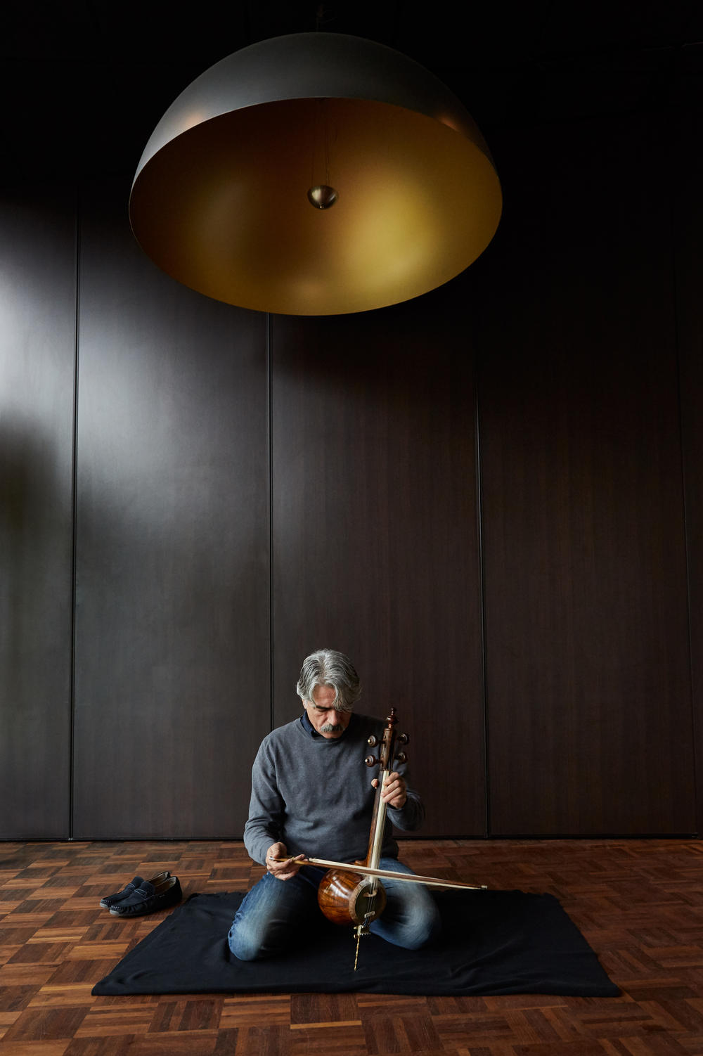 Kalhor plays the <em>kamancheh</em> in 2017. When he left Iran at age 17, he carried only two items with him: a small backpack and his main musical instrument, the <em>kamancheh</em>.