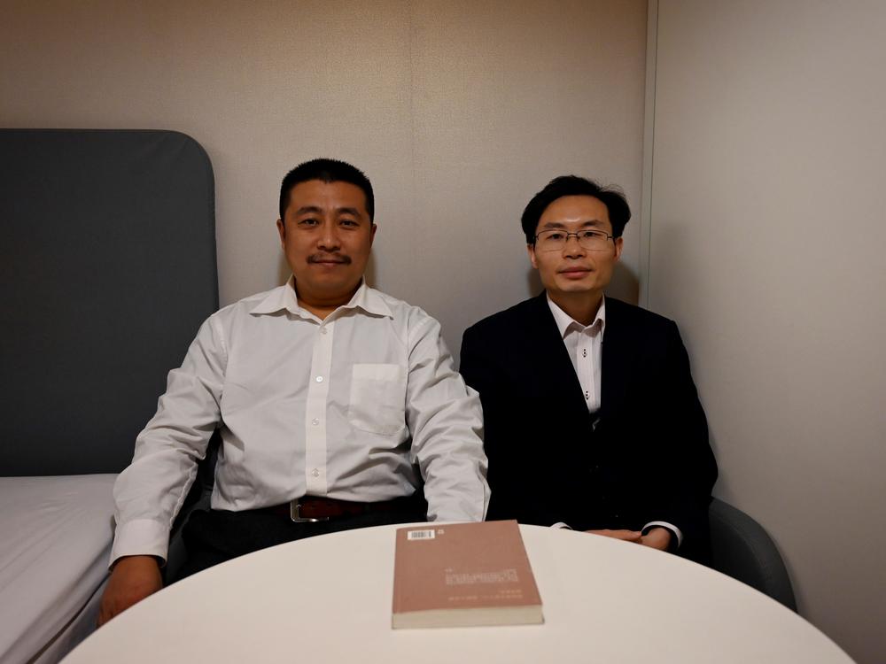 Lawyers Ren Quanniu (left) and Zhang Keke representing Chinese citizen journalist Zhang Zhan, who reported on Wuhan's coronavirus outbreak and was detained in May, during an interview with Agence France-Presse on Dec. 27 in Shanghai ahead of their client's trial.