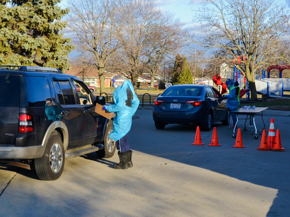 Before conducting the nasal swab test for COVID-19 at the Rantoul, Ill., clinic, researchers go out to greet each visitor and ask for basic identification and health information.