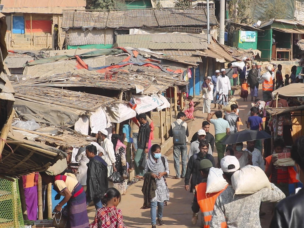 Rohingya refugees walk at the Balukhali refugee camp in Cox's Bazar, Bangladesh, on Feb. 2. Rohingya refugees from Myanmar living in camps in Bangladesh are condemning the military coup in their homeland and saying it makes them more fearful to return. A brutal counterinsurgency operation by Myanmar's military in 2017 drove more than 700,000 Rohingya Muslims to neighboring Bangladesh.