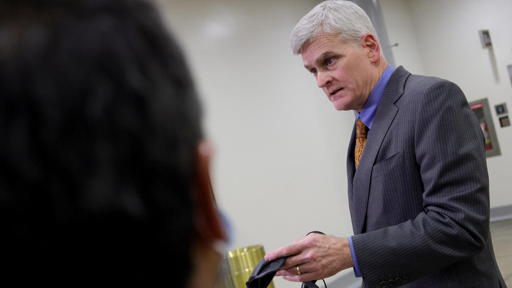 Sen. Bill Cassidy, R-La., talks with reporters while departing the U.S. Capitol after the third day of the impeachment trial.