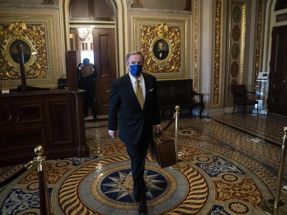 Michael van der Veen, lawyer for former President Donald Trump, walks to the Senate floor through the Senate Reception room on the fourth day of the Senate Impeachment trial for former President Donald Trump.