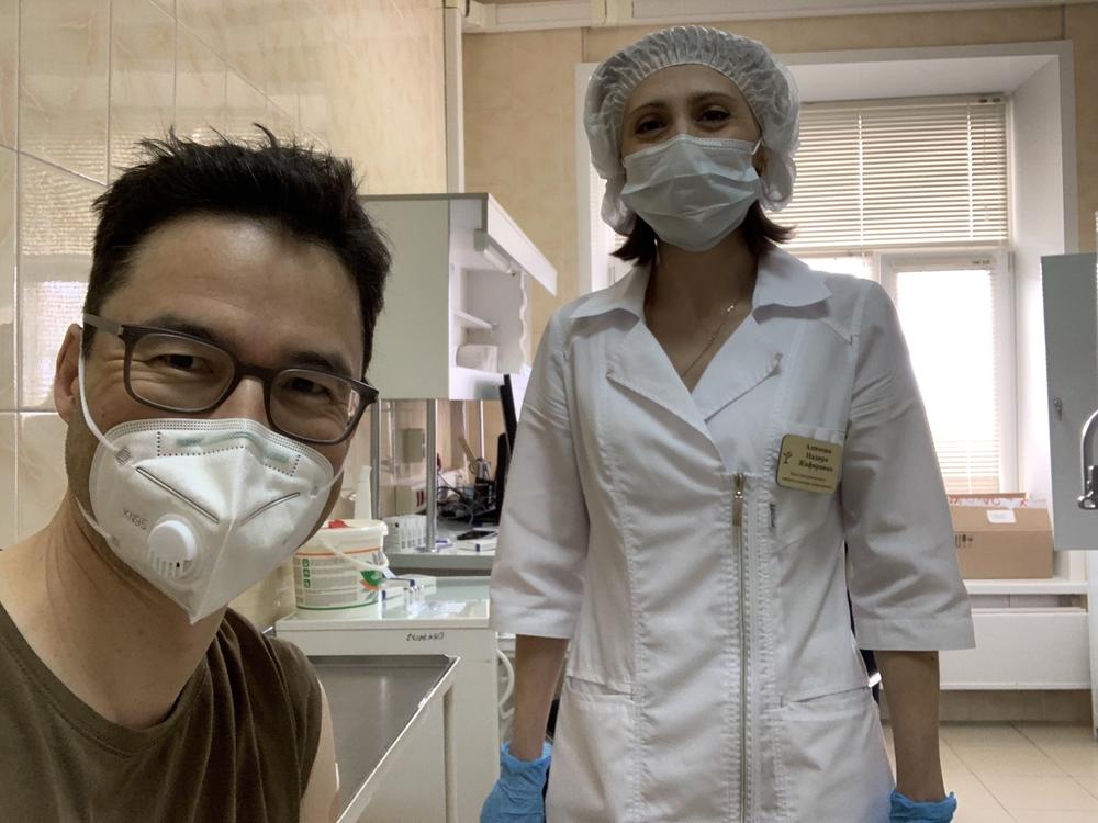 This week NPR Moscow correspondent Lucian Kim got vaccinated with Sputnik V, the COVID-19 vaccine that Russian President Vladimir Putin is promoting as the best in the world. Above: Kim smiles (behind his mask) after his shot.