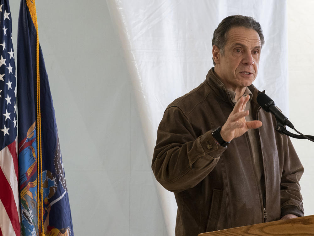 New York Gov. Andrew Cuomo speaks to reporters during a news conference at a COVID-19 pop-up vaccination site in Brooklyn on Jan. 23. Cuomo has defended the state's reporting of nursing home deaths.