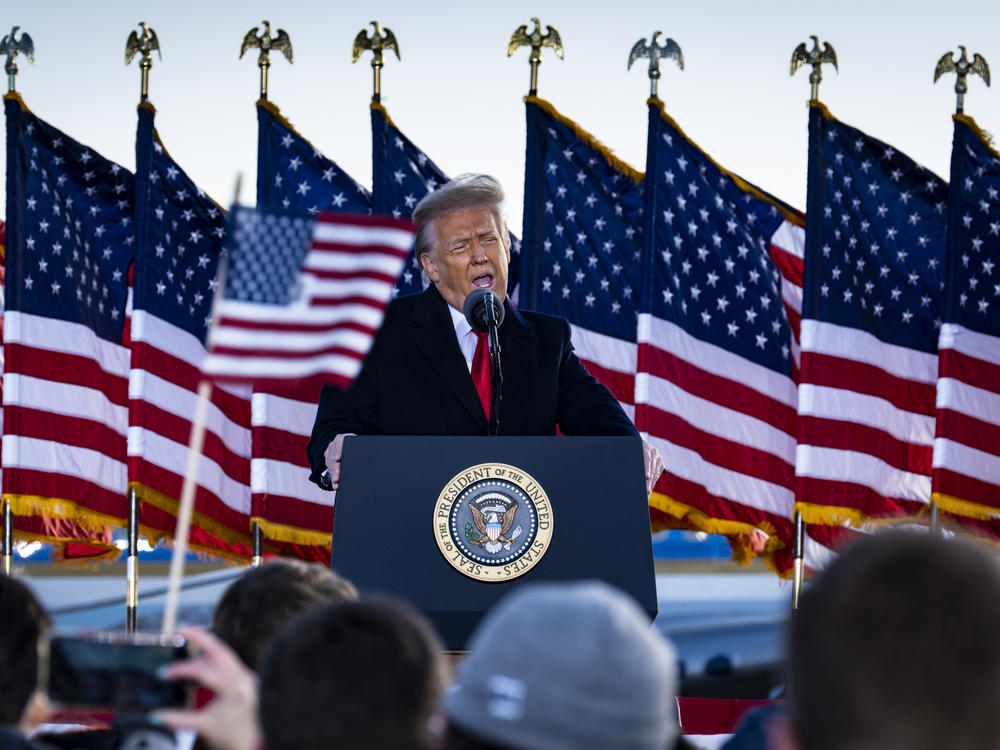 Former President Donald Trump, seen here speaking to supporters on Jan. 20 while still president, attacked Senate Minority Leader Mitch McConnell in a statement Tuesday evening.