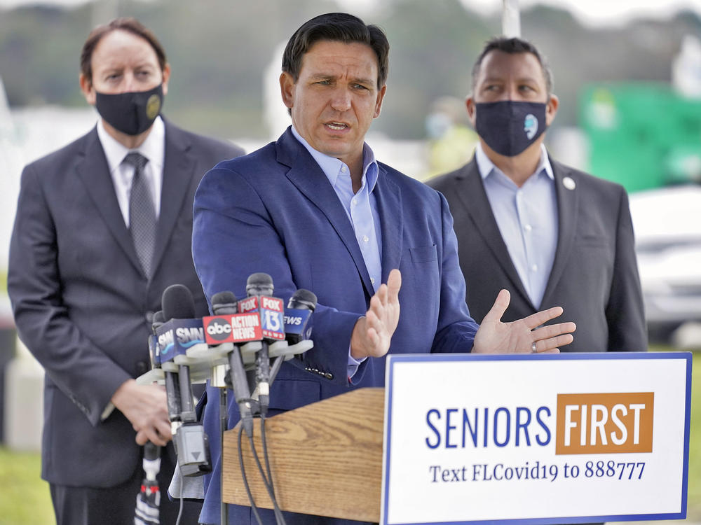 Florida Gov. Ron DeSantis speaks to the media at a COVID-19 vaccination site near the upscale Lakewood Ranch community in Bradenton, Fla., on Wednesday.