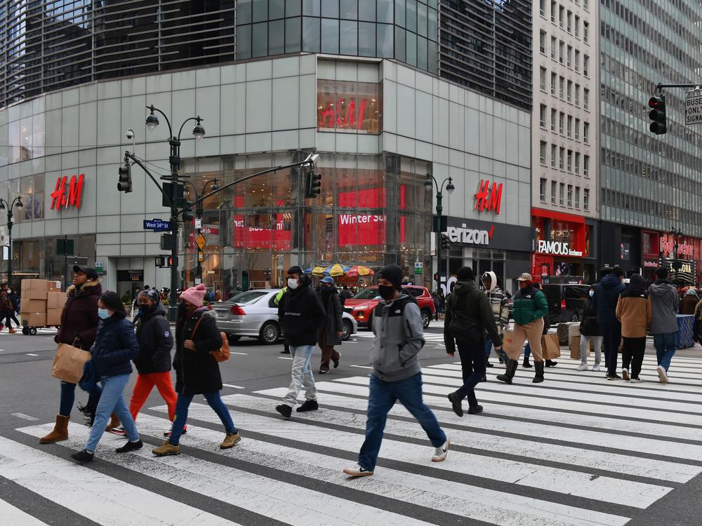People walk in front of stores in New York's Herald Square. Retail sales soared 5.3% last month compared to December as U.S. families began receiving new federal coronavirus relief checks.