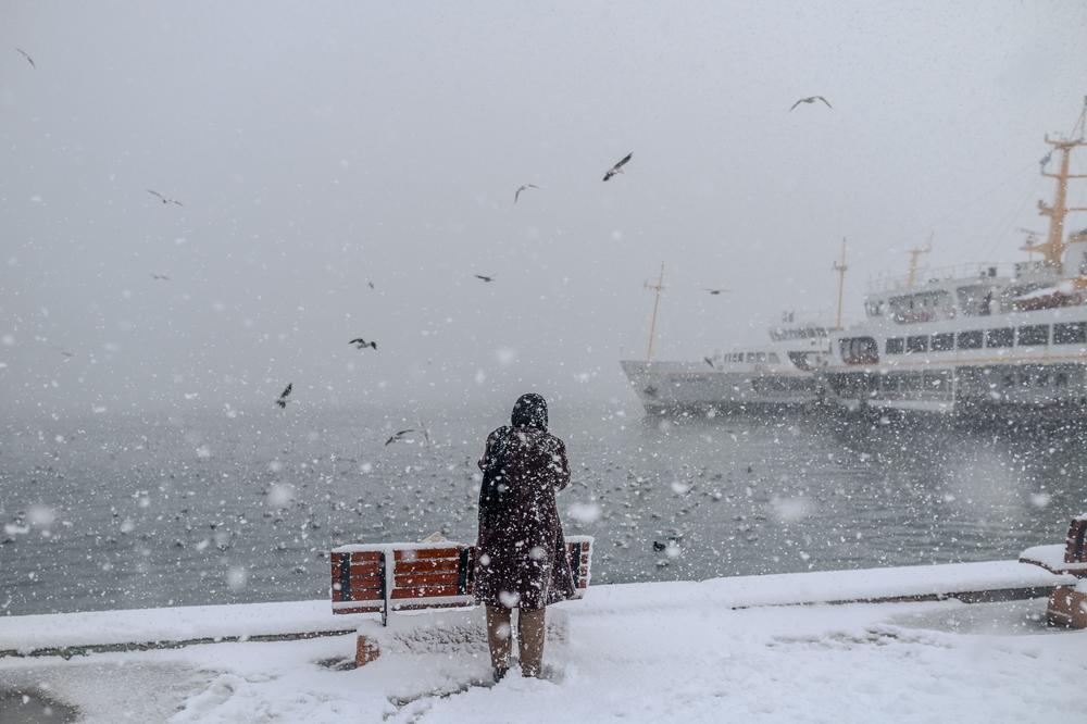 Seagulls circle over the snow-covered wharf during a heavy snow storm in the Kadikoy district of Istanbul early on Wednesday.