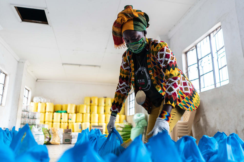 Rachael Mwikali from the Coalition for Grassroots Human Rights Defenders Kenya prepares bags of food aid in April 2020. The group is distributing them to families in Nairobi who have lost their income due to COVID-19.
