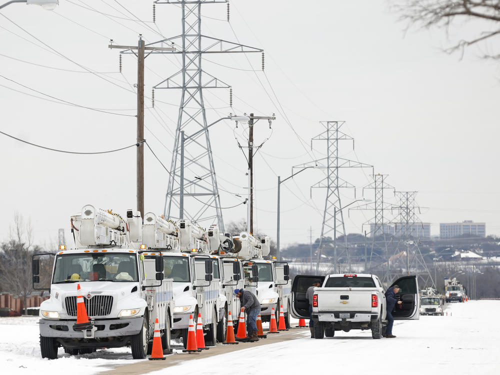 Electric service trucks line up after a snow storm on Feb. 16, 2021 in Fort Worth, Texas. The White House said on Thursday that FEMA was mobilizing to help assist the response to winter weather that has left hundreds of thousands without power in Texas.