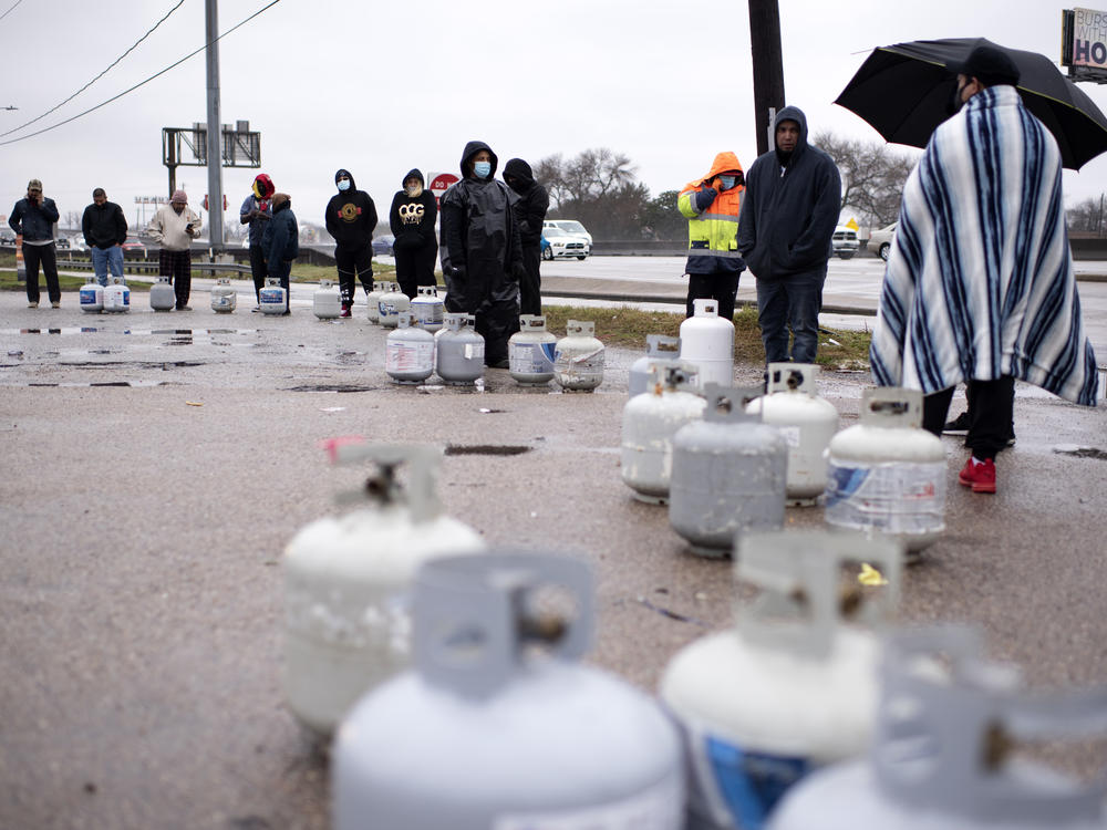 People in Houston wait in line to fill their propane tanks on Wednesday amidst widespread power outages related to the winter storm. Cases of carbon monoxide poisoning in the state have increased in recent days, with officials attributing most to the improper use of heating devices like charcoal grills and portable generators.