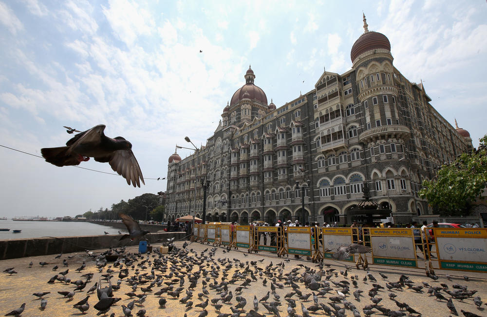 The Taj Mahal Palace Hotel in Mumbai. The Indian industrialist Jamsetji Tata commissioned the hotel after the plague struck Bombay. His goal was to to boost the morale of the ravaged city with a new landmark. The hotel opened in 1903.