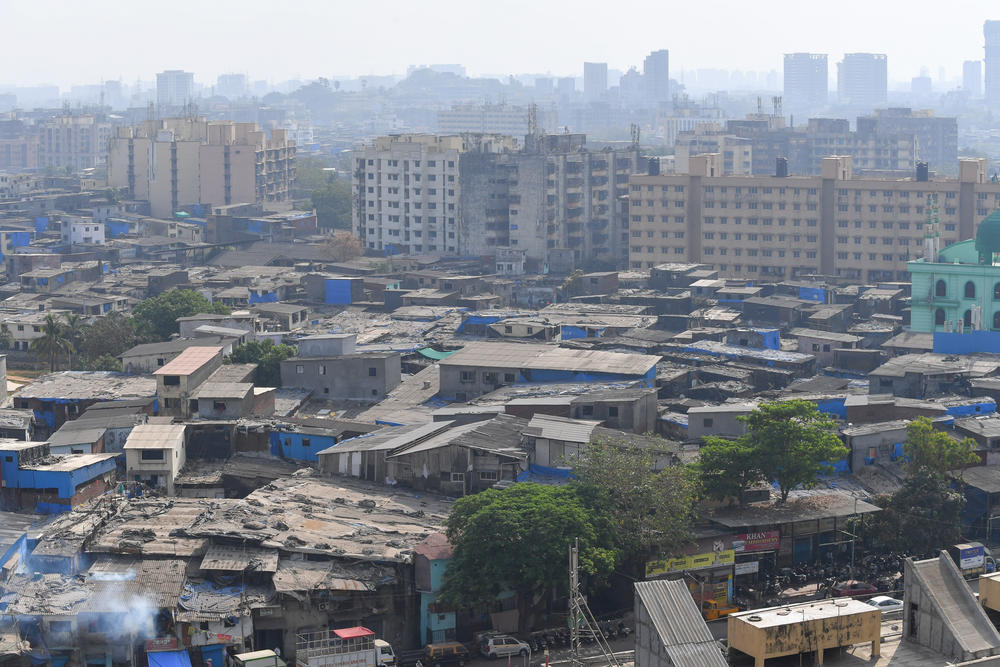 Smoke billows on April 6 during fumigation in Mumbai's Dharavi slum — intended as a disinfectant during the pandemic although there is no evidence that this measure is effective.