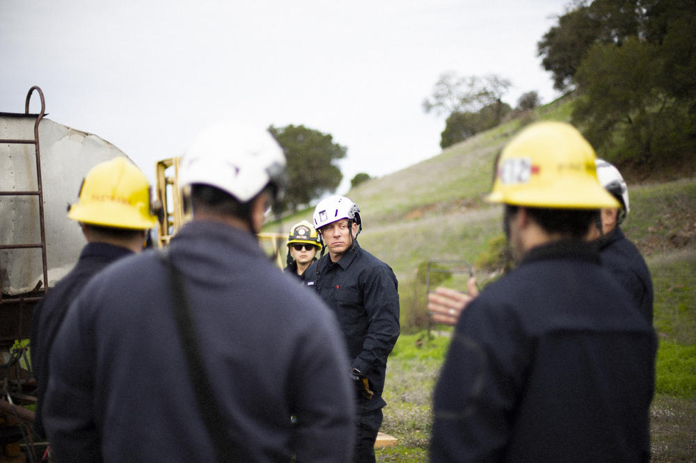 Newberry (center) attends a training with his Napa County Fire Rescue Team. The wellness program aims to not only provide support <em>after</em> an incident, but also help firefighters better process what they experience in the moment.